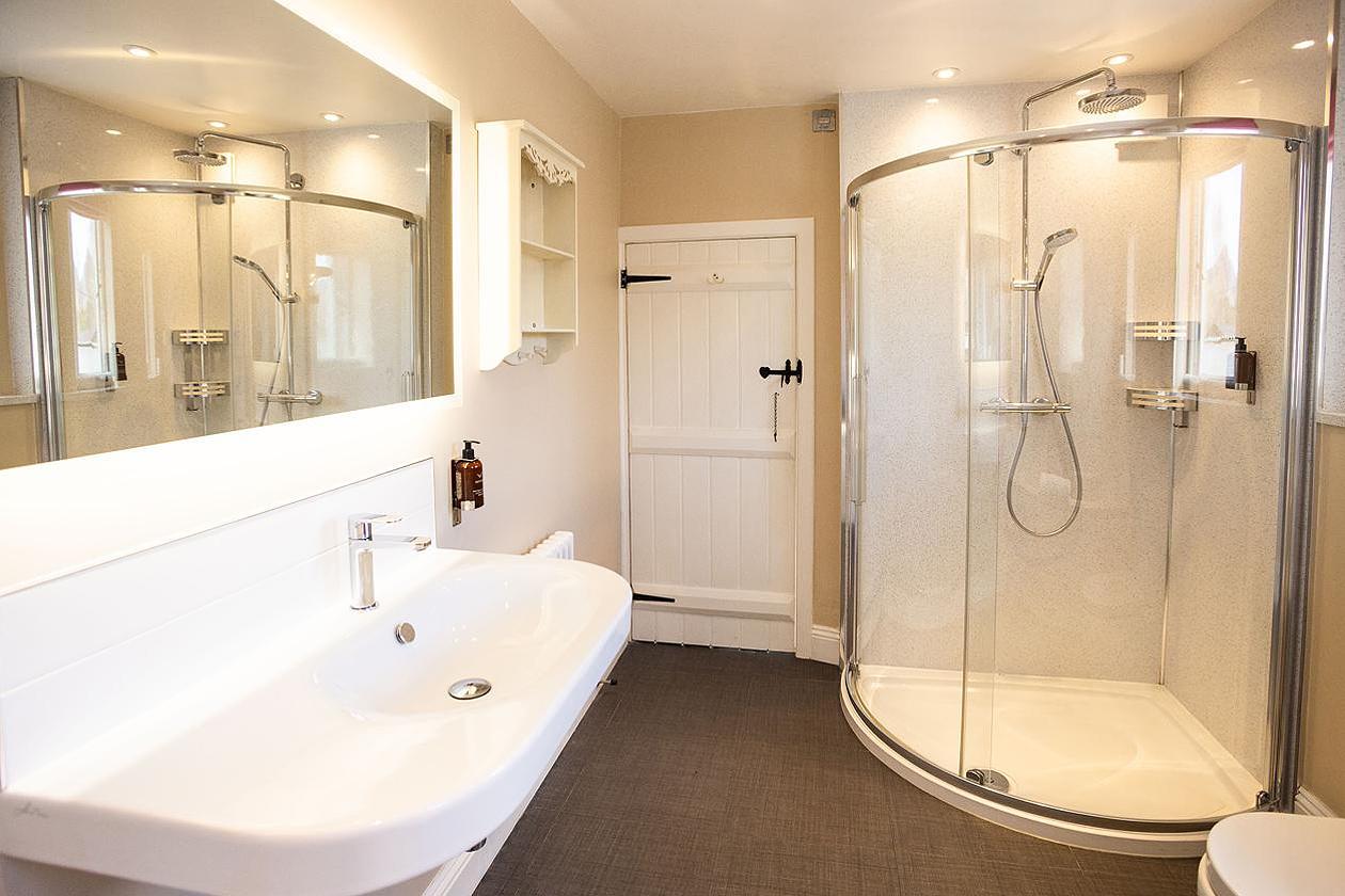 Main bathroom with bath and shower