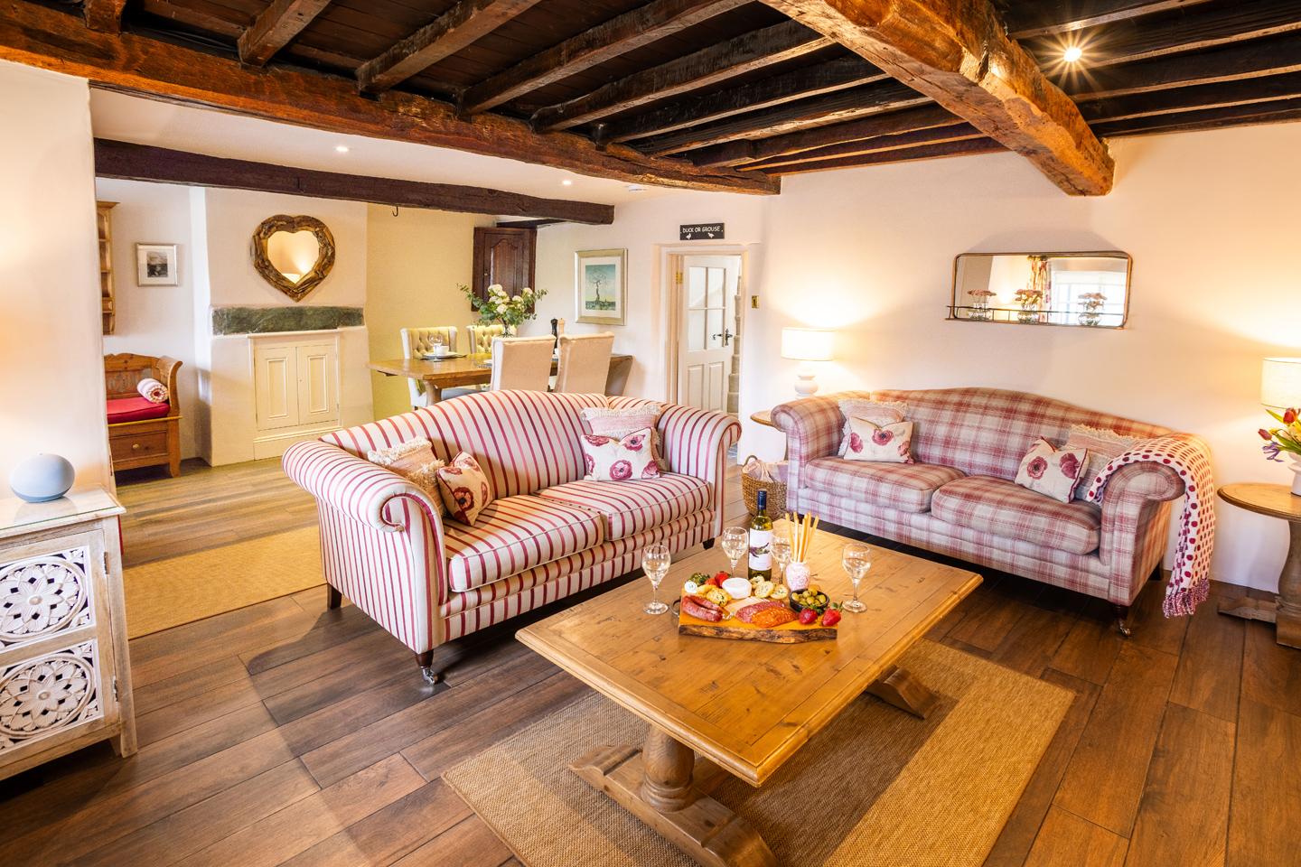 Open plan living with lounge and dining area at Porch Cottage, Keswick